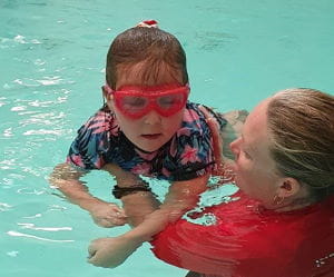 Ruby with her instructor in the pool at Kwinana