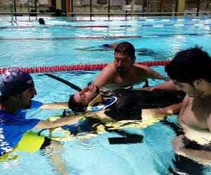 Saudi lifeguards practising in water rescue