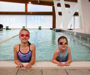 Freya and Millie Hollingsworth in the pool at Bold Park Aquatic Centre