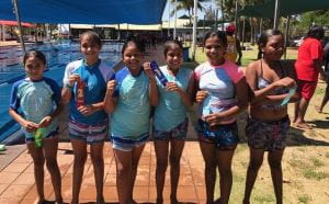 6 Aboriginal girls with their place ribbons by the pool at Gratwick Aquatic Centre