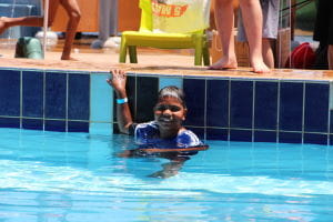 An Aboriginal boy in the swimming pool
