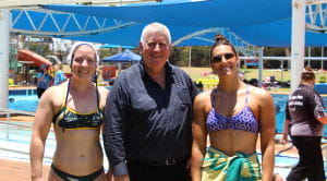 Mayor of Port Hedland Peter Carter with two girls in water polo gear