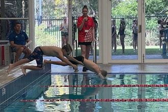 boys diving into pool at the 2021 Swan Active JLC Carnival