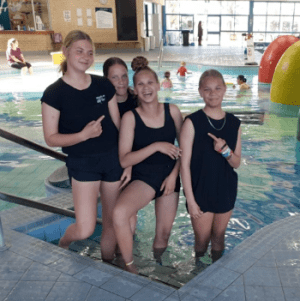 Four Aboriginal girls standing on the steps of the pool at Swan Active Midland