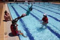 girl diving into the pool