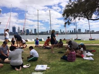 program participants learning CPR with manikins on the South Perth foreshore