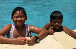 Two Indonesian boys in the pool at Keramas Park swim school Indonesia