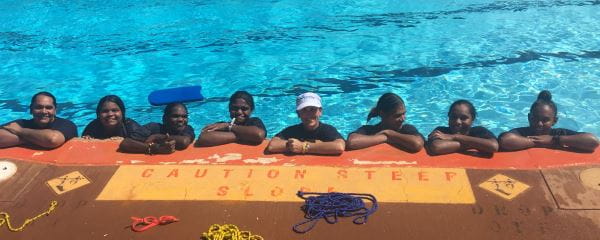 Talent Pool participants with their trainer in the water at Roebourne