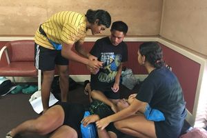 pool lifeguard course participants practising first aid techniques