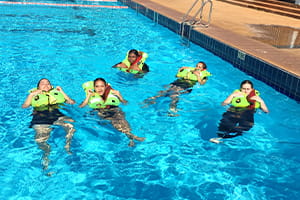 Hedland SHS students wearing PFDs in a pool