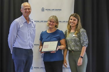 Leanne Coverley-Brandis being presented with an Honours Award at the 2021 Trainers Christmas Party
