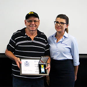 Bill Johnson receiving his award