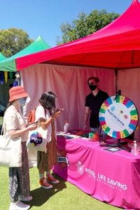 students visiting the RLSSWA stall at a uni open day