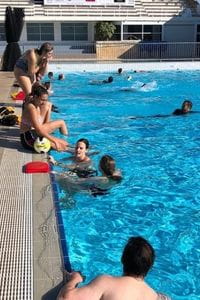 Students practising rescue skills in the pool