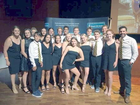 WA Lifesaving team gathered together wearing formal attire at the presentation event for the Australian pool Lifesaving Championships