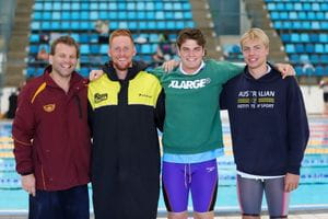 Four competitors standing by the pool