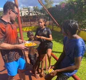 Children receving pieces of orange at Warburton pool