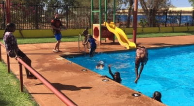 Children at Warburton enjoying the pool while to pool manager watches on