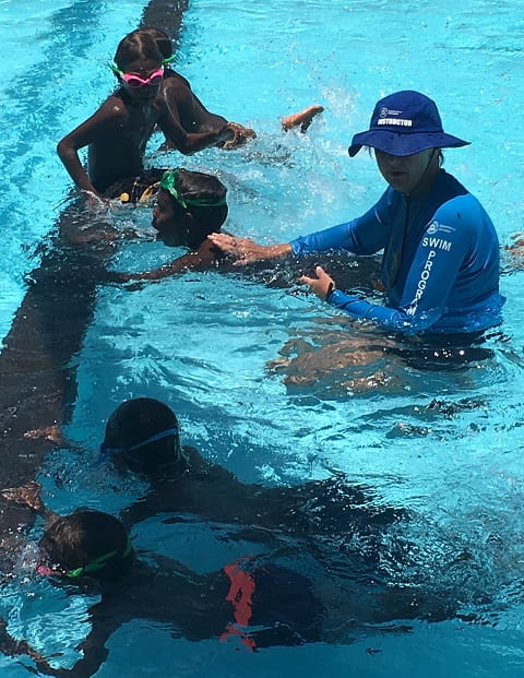VacSwim instructor Diana Papenfus teaching aboriginal children at the Warburton swimming pool