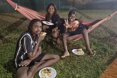three girls enjoying a meal at the Warmun pool