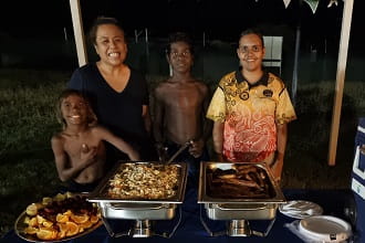 Warmun's Aisyah Waterman with food she cooked for the community night pool party