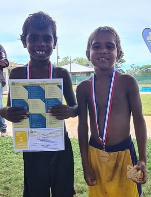 Two Purnululu school boys with swimming certificates