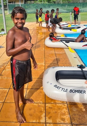 Aboriginal boy giving a thumbs up at the local pool