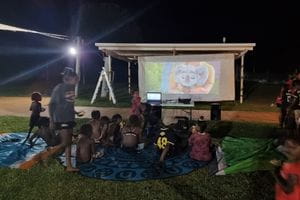 Warmun families watching a movie at the local pool