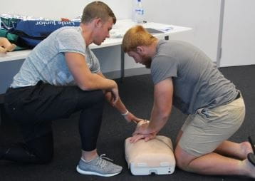 Two Western Force players practising CPR