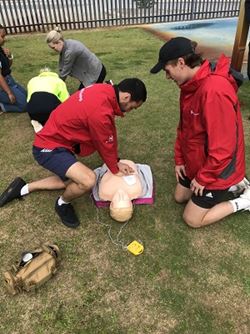 Workforce Solutions team practising CPR on manikins