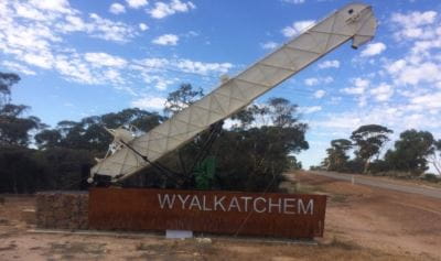 Sign for Wyalkatchem with a crane and landscape behind