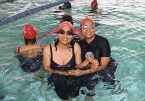 Two multicultural women in the pool at Cannington enjoying their Women's Only swimming lesson