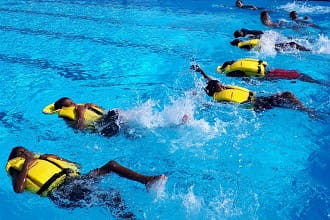 Wyndham kids floating on their backs wearing lifejackets
