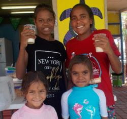 Four aboriginal girls enjoying smoothies at Yandeyarra pool