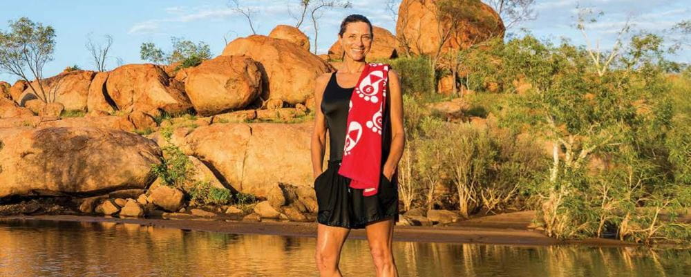 Image of remote pool manager Jacqui Forbes by a Kimberley waterhole