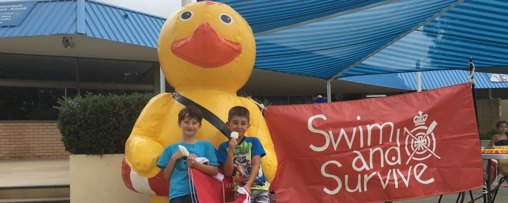 two young boys standing with inflatable Quackers at the Armadale Aquatic Centre