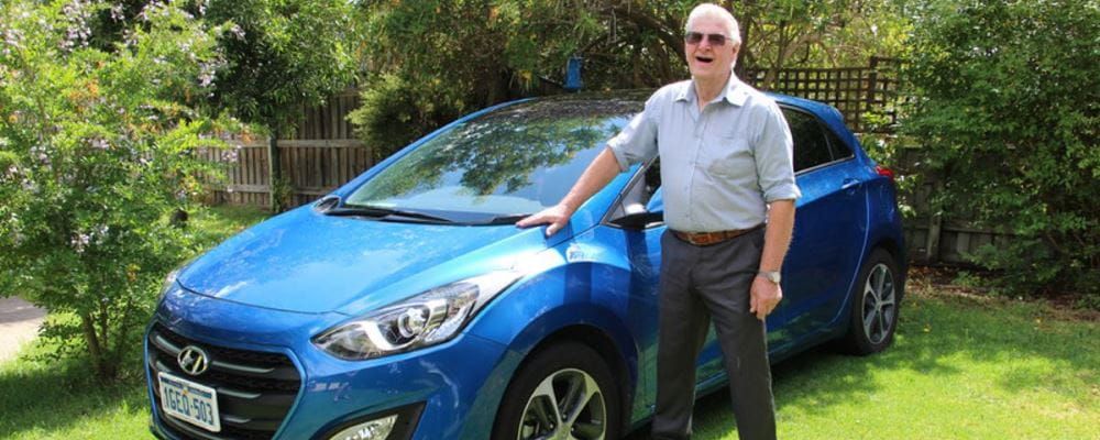 Arnold with his Hyundai i30 in his front garden