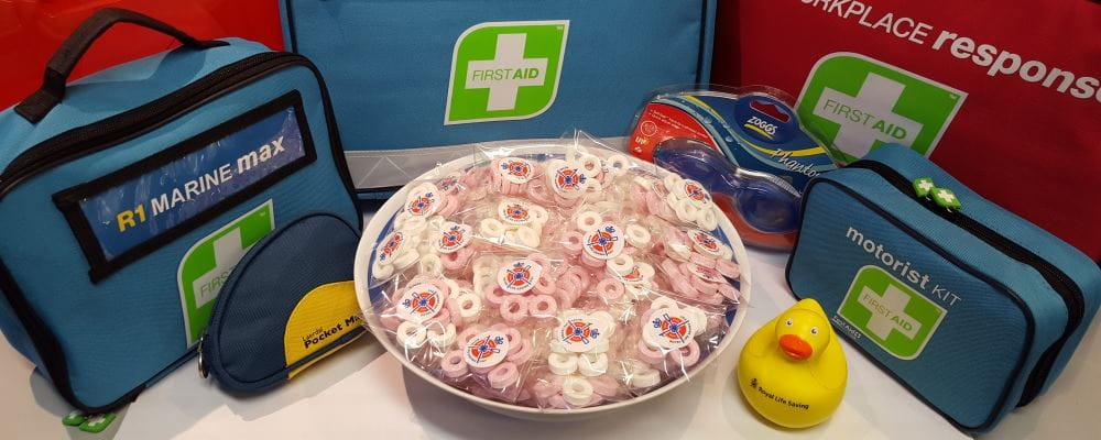 Small display Lifesaver packets surrounded by first aid kits