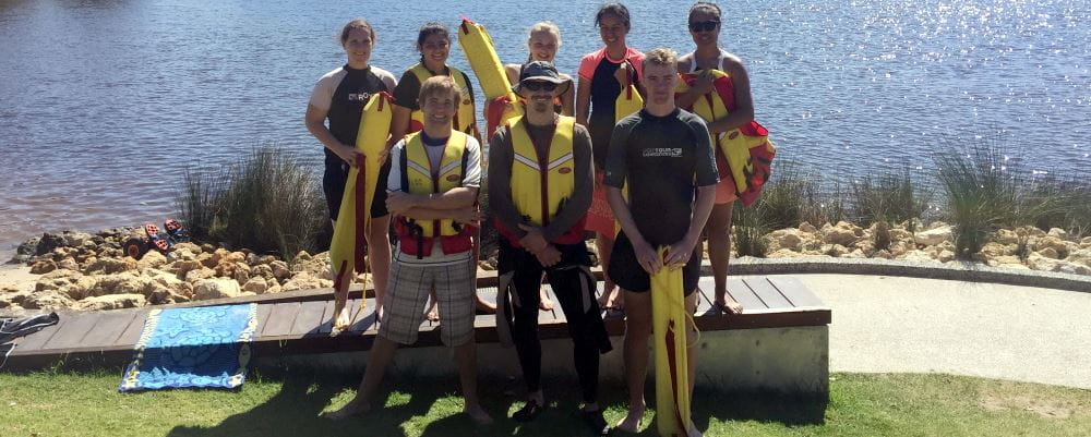 8 participants standing bu the Swan River at Ascot with rescue gear