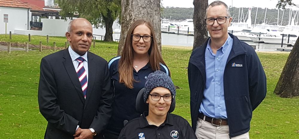 Dr Sudhakar Rao from Royal Perth Hospital, Lauren Nimmo from Royal Life Saving, Carl Akira Fujinami from the Paraplegic Benefit Fund and Rod Annear from the Parks and Wildlife Service by the river at Matilda Bay