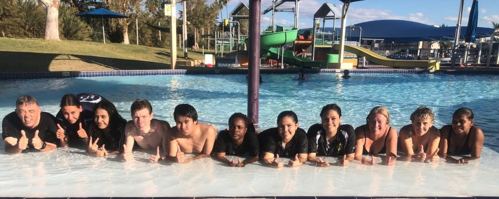 Tim Turner with a group of AUSTSWIM students in the pool at Port Hedland