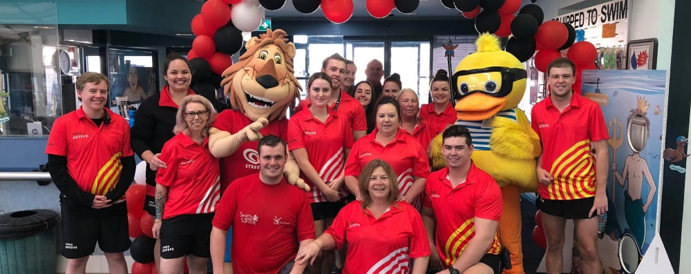 A large group of aquatic centre workers celebrate the City of Swan leisure centre open day