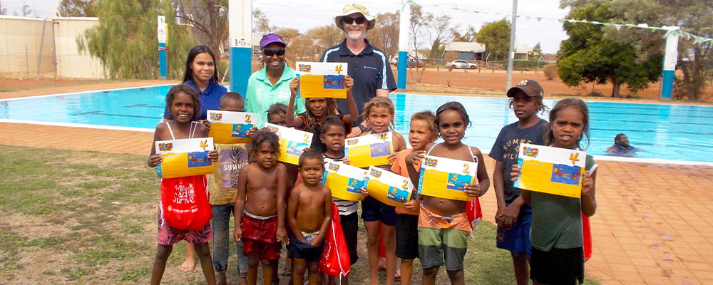 Burringurrah children holding their swimming certificates