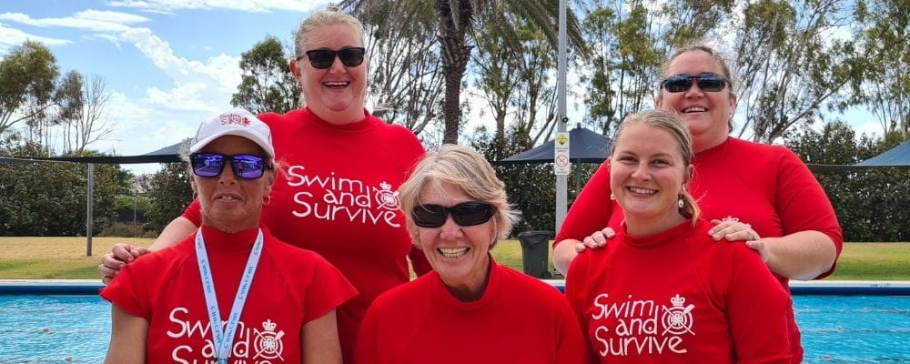 Five swim instructors by the pool at Carnarvon