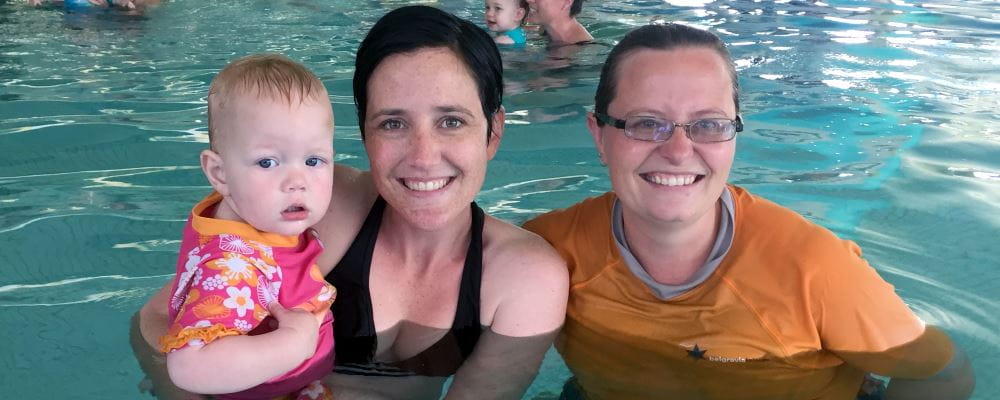 Rozanne Lily with her mum and swim instructor Kath Kuschurt in the swimming pool at Belmont Oasis