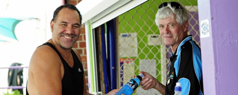 Colin Hassell (right) with a patron at one of WA's regional pools