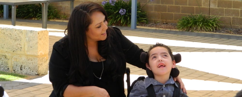 image of mum Simone Soto-Flores, with son Ari, who received a Community Help Grant following his non-fatal drowning which left him with severe brain damage.