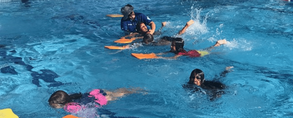 Children swimming with kickboards at Coolgardie