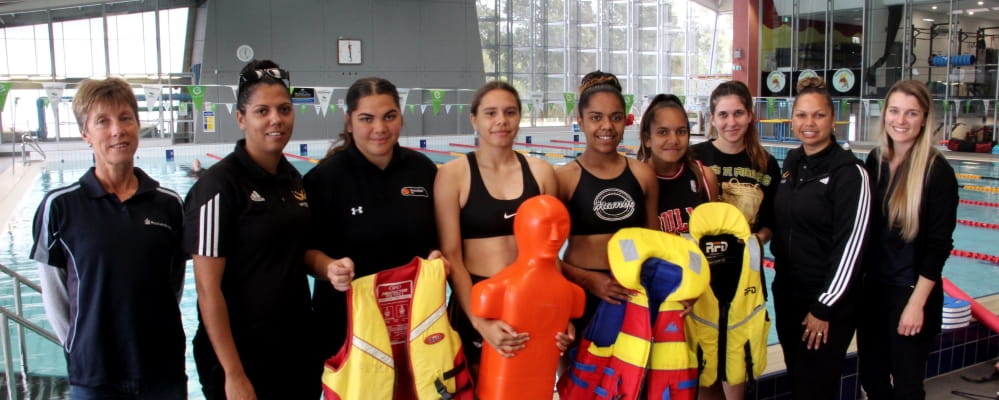 Aboriginal girls in the pool at Kwinana Requatic with their swim instructors