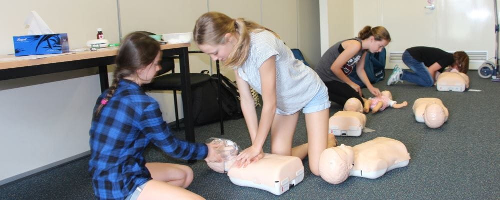image of young girls practising CPR